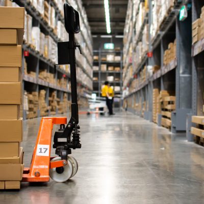 Cartons on pallet trucks in the warehouse